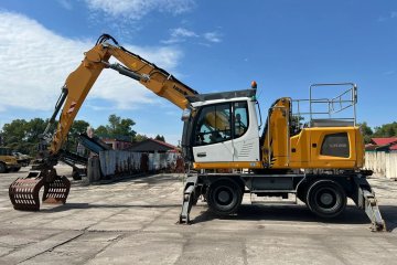 koparka przeładunkowa na podwoziu kołowym, chwytak, podpory, klima